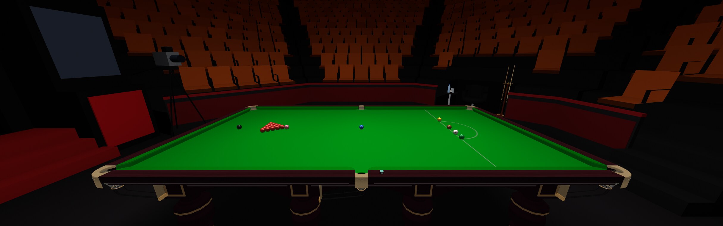 A snooker table set up in an arena