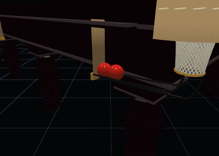 The underside of a snooker table: the
    brass ring at the bottom of a string bag, and the wire collector running away along the side